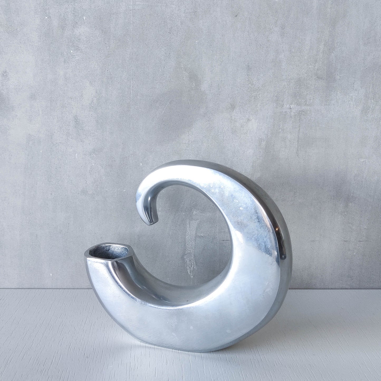 Vintage 1990s cast aluminium curved C shaped sculptural vase signed