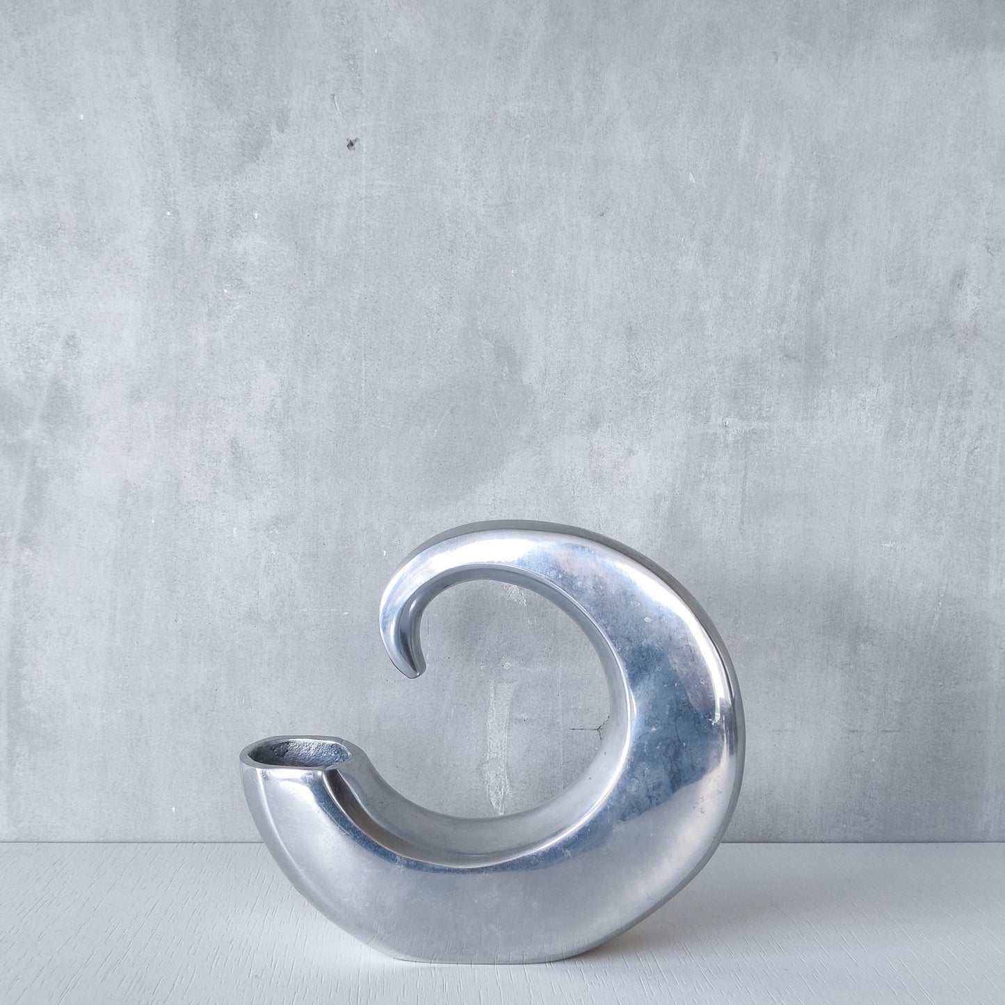 Vintage 1990s cast aluminium curved C shaped sculptural vase signed