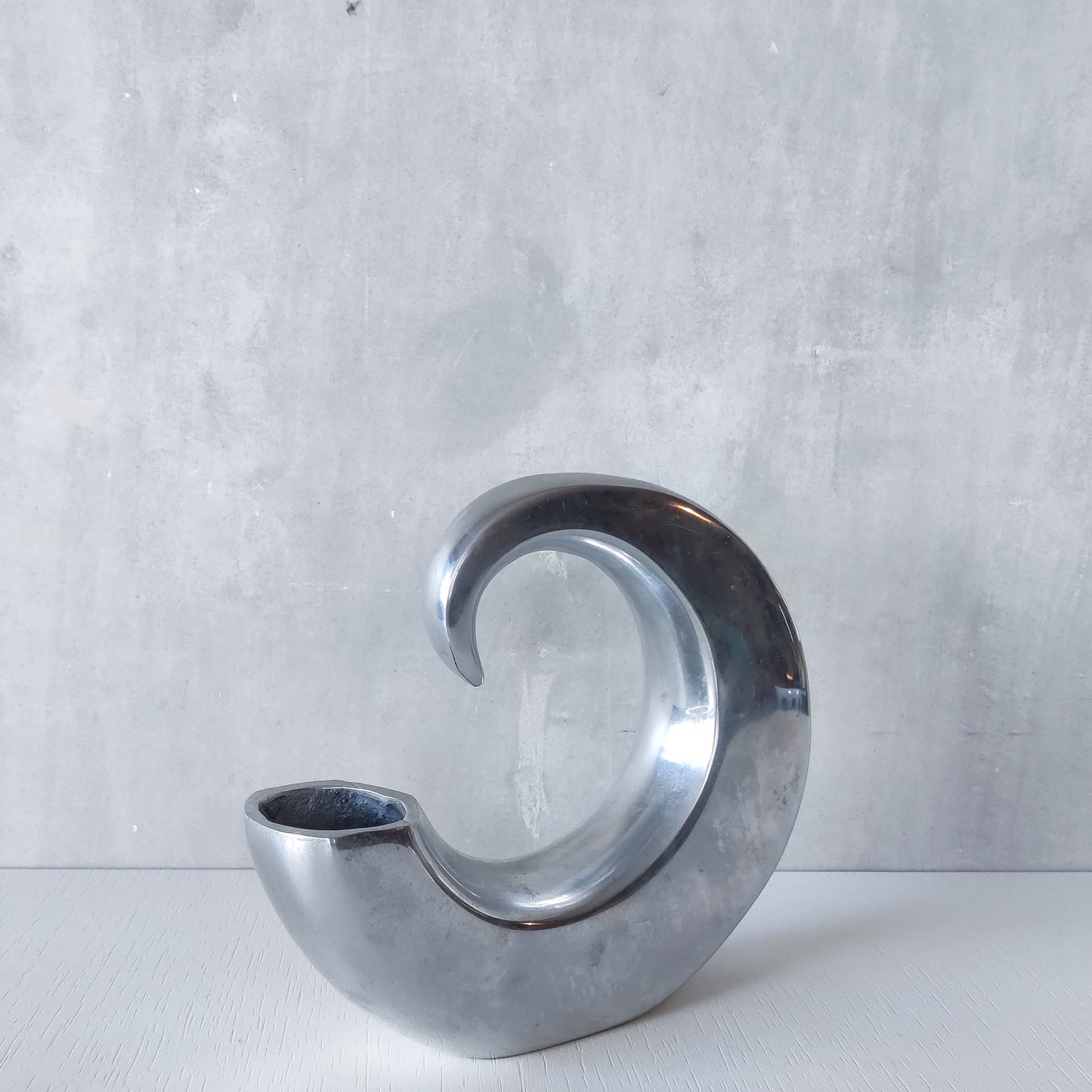 Vintage 1990s cast aluminium curved C shaped sculptural vase signed