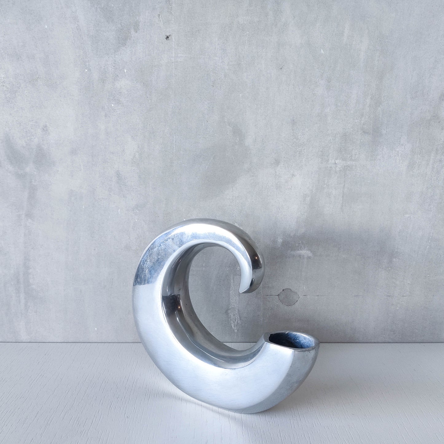 Vintage 1990s cast aluminium curved C shaped sculptural vase signed