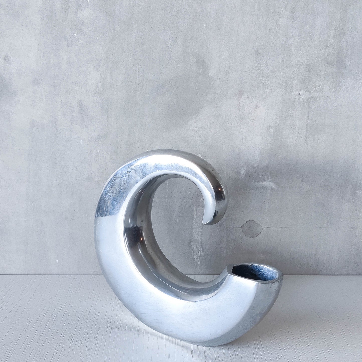 Vintage 1990s cast aluminium curved C shaped sculptural vase signed