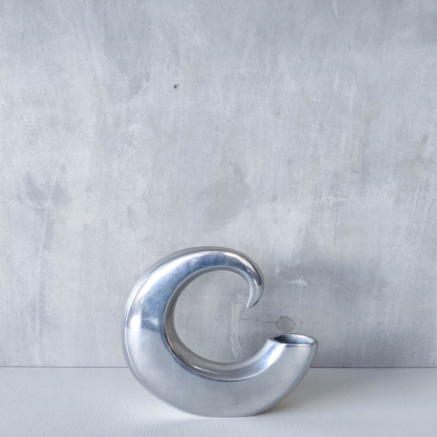 Vintage 1990s cast aluminium curved C shaped sculptural vase signed