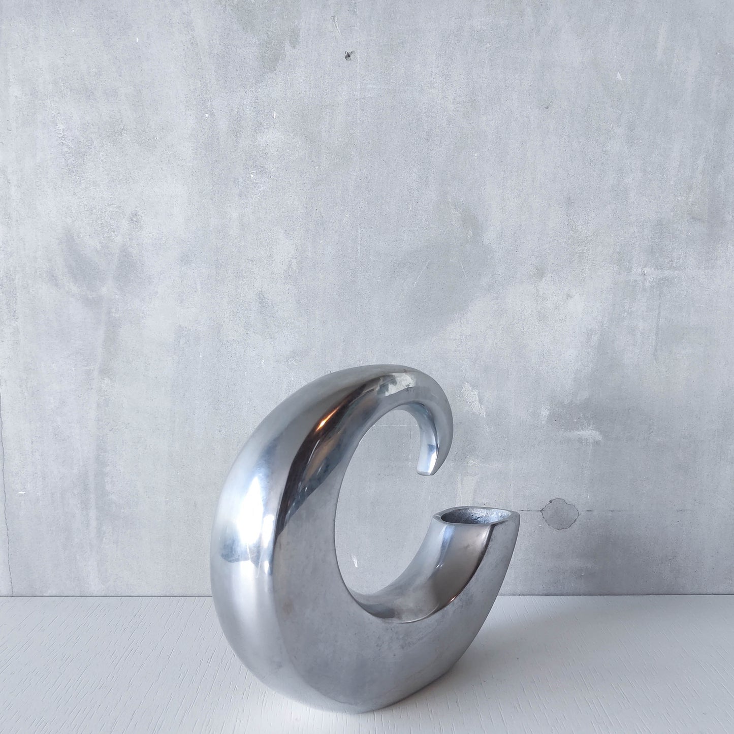 Vintage 1990s cast aluminium curved C shaped sculptural vase signed