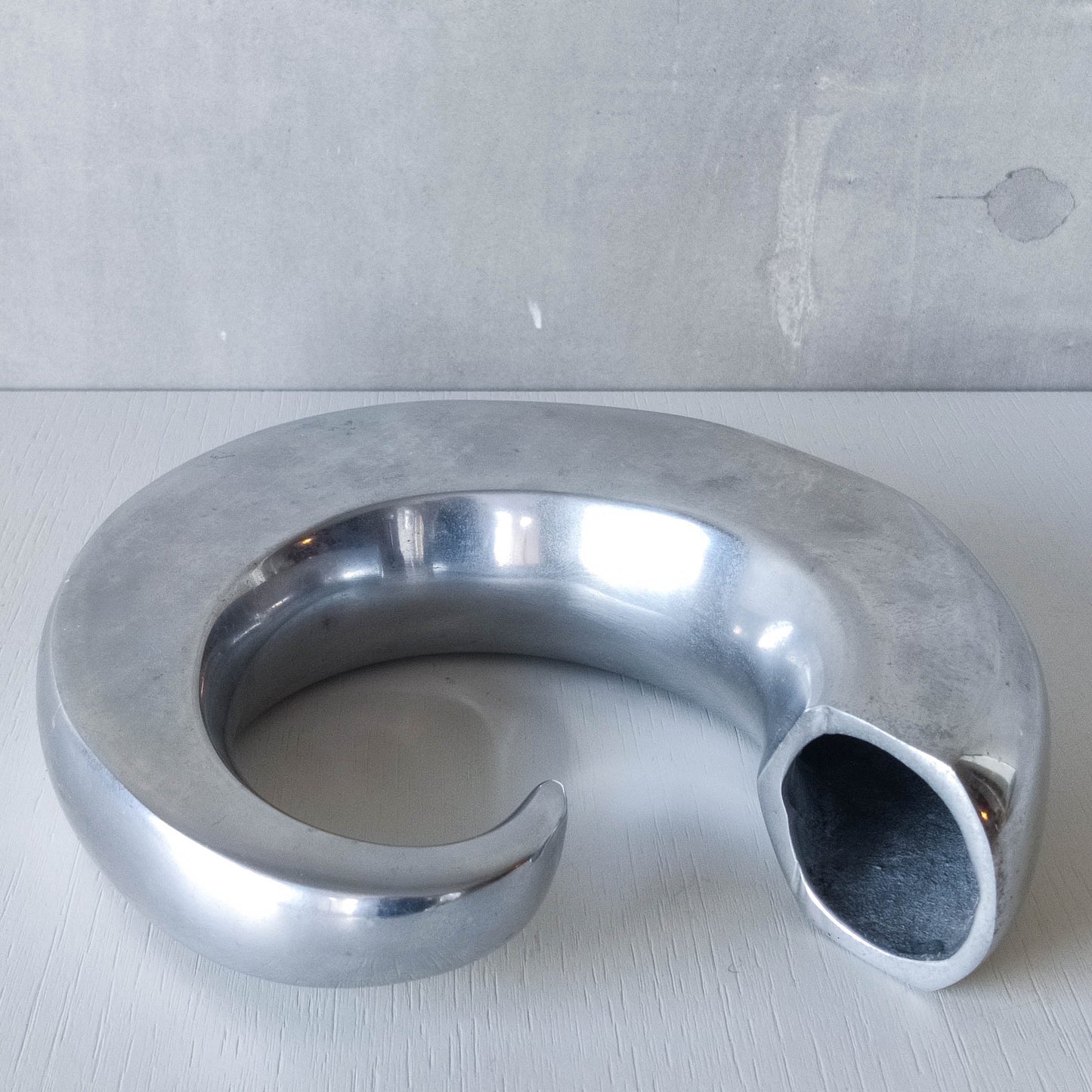 Vintage 1990s cast aluminium curved C shaped sculptural vase signed