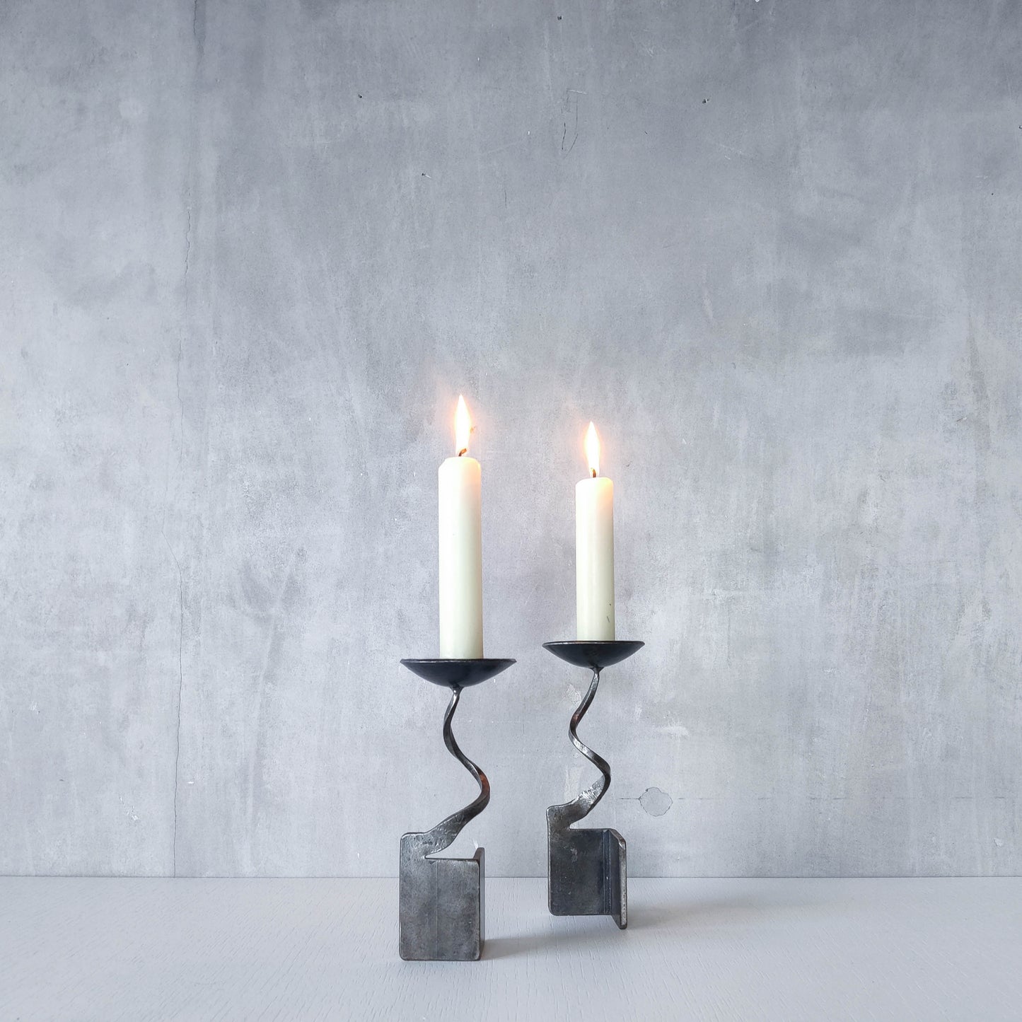 Pair of brutalist style metalwork forged steel sculptural candle holders
