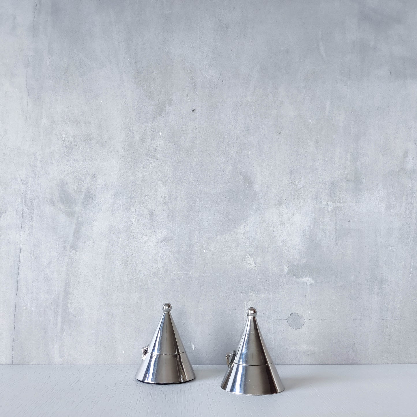 Pair of vintage conical silver chrome tea light holders Aldo Rossi Alessi modernist
