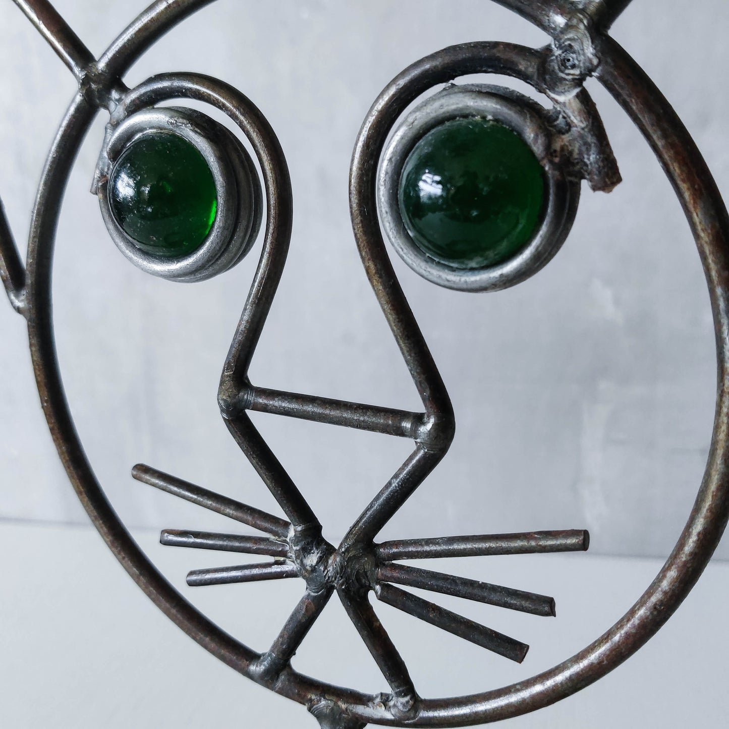 Vintage metalwork welded steel large cat face candle holder with green glass eyes
