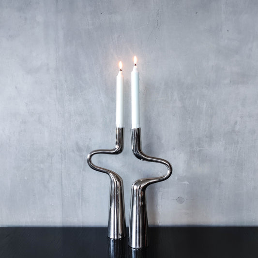 Pair of large curved chrome sculptural interlocking candle holders
