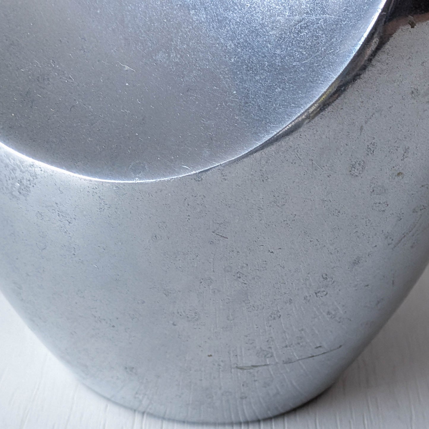 A vintage cast aluminium abstract surrealist twisted vase vessel