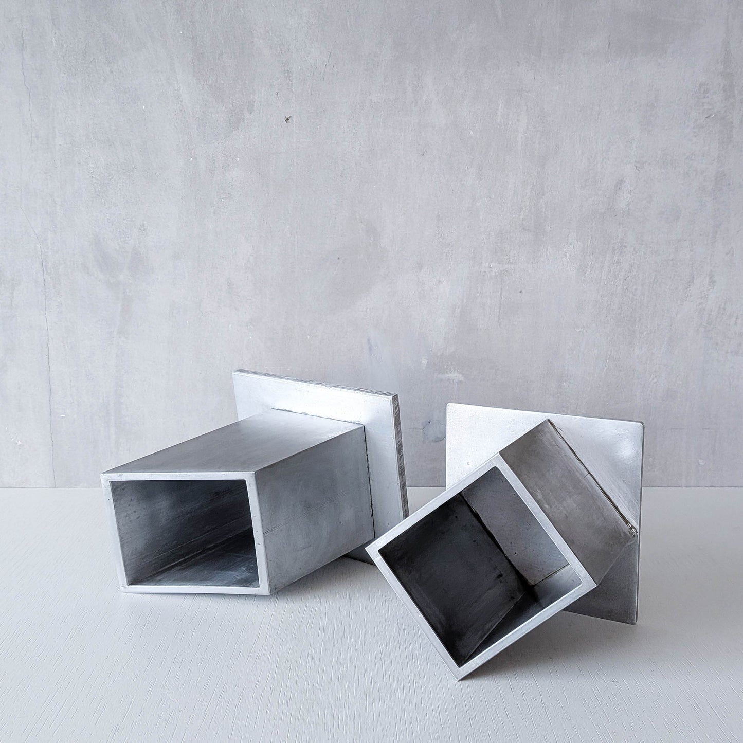 Pair of vintage scratch built sculptural aluminium desk tidy pen holders