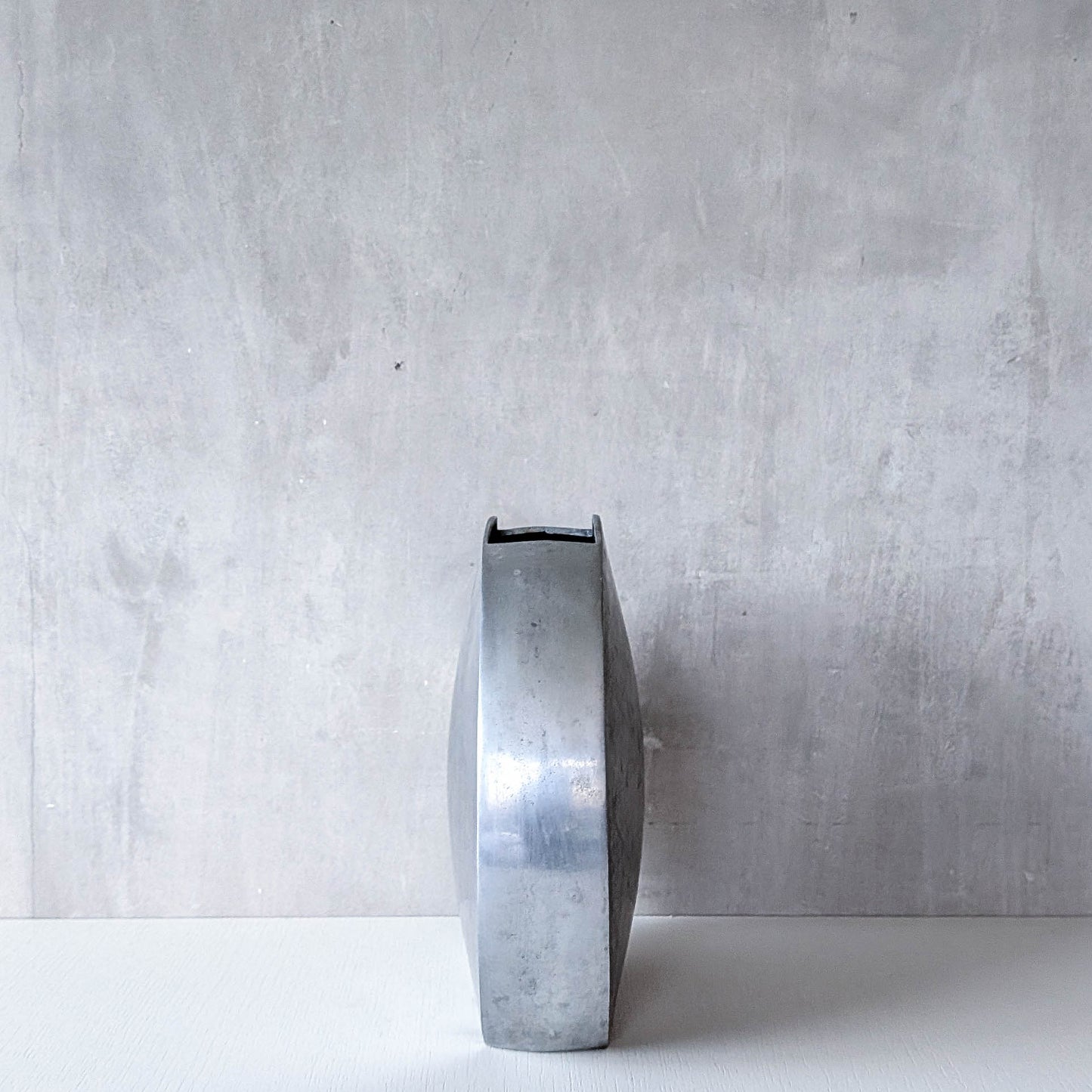 Vintage large sculptural round flat Art Deco style cast aluminium vase