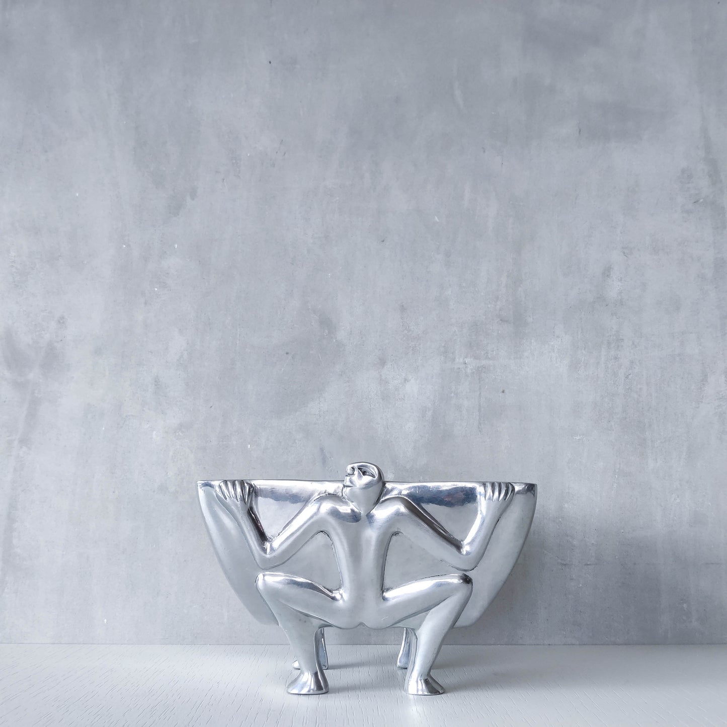 Carrol Boyes 1990s sculptural cast aluminium rectangular fruit bowl with figural feet