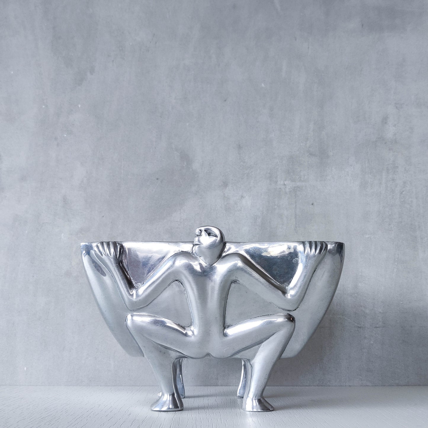 Carrol Boyes 1990s sculptural cast aluminium rectangular fruit bowl with figural feet