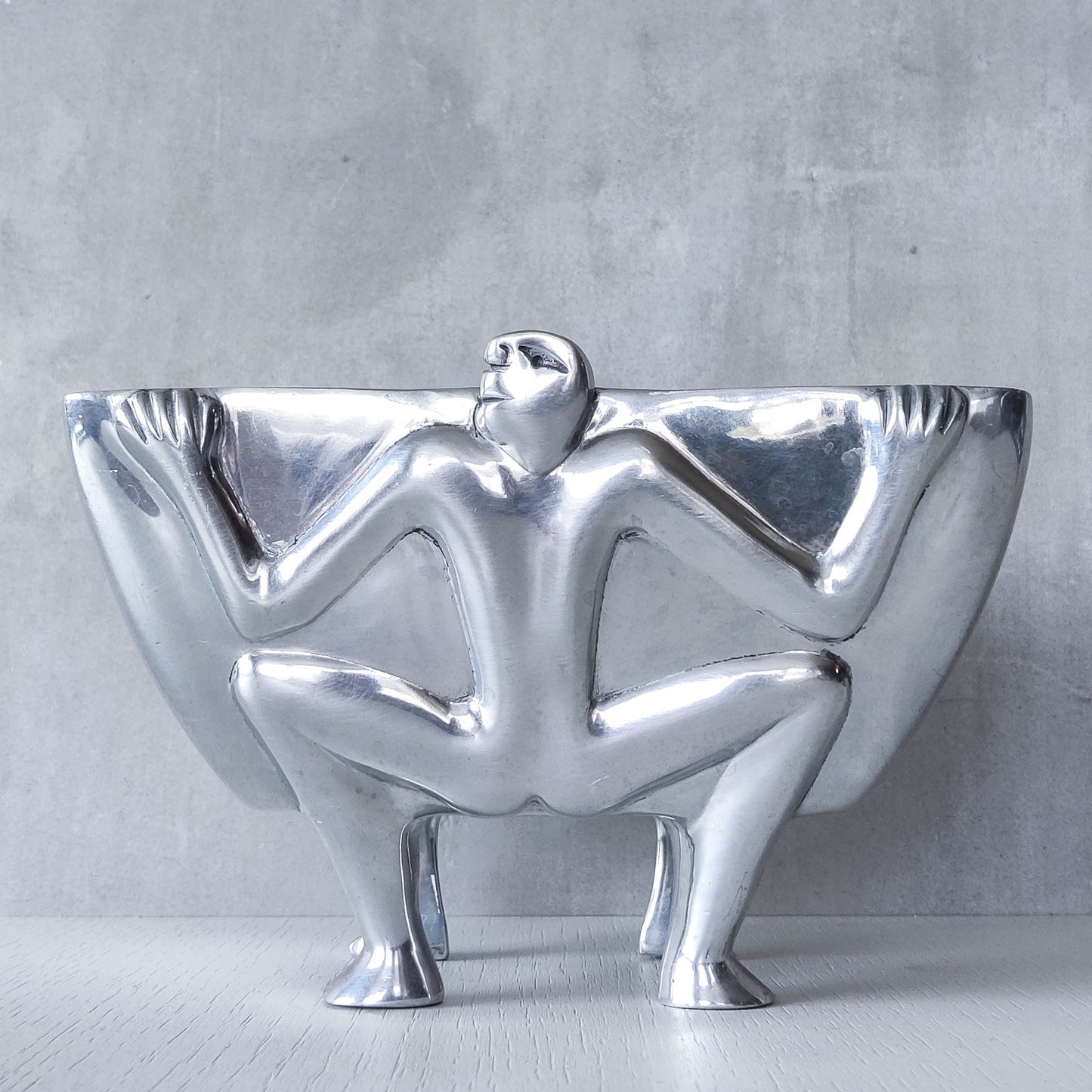 Carrol Boyes 1990s sculptural cast aluminium rectangular fruit bowl with figural feet