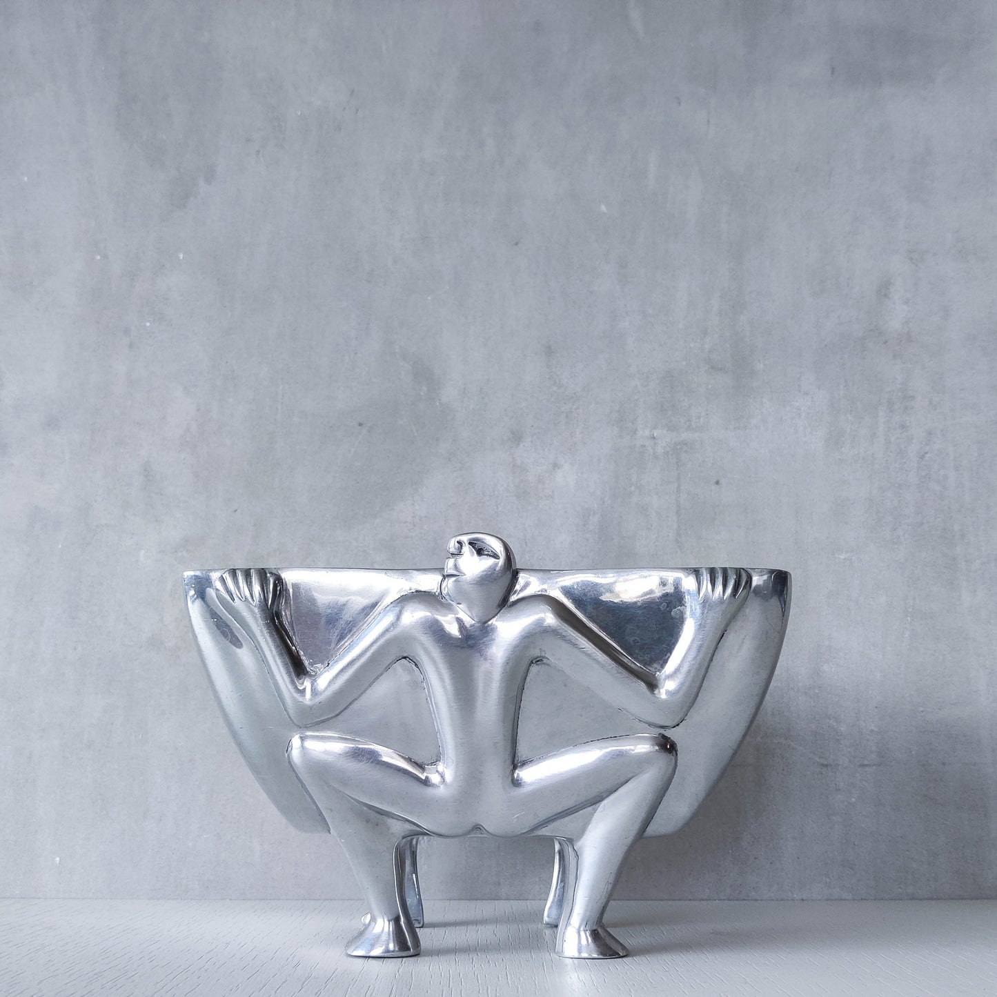Carrol Boyes 1990s sculptural cast aluminium rectangular fruit bowl with figural feet