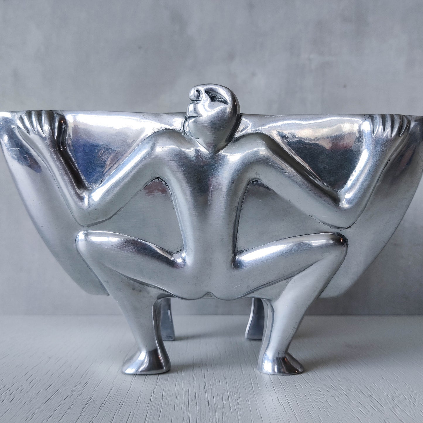 Carrol Boyes 1990s sculptural cast aluminium rectangular fruit bowl with figural feet