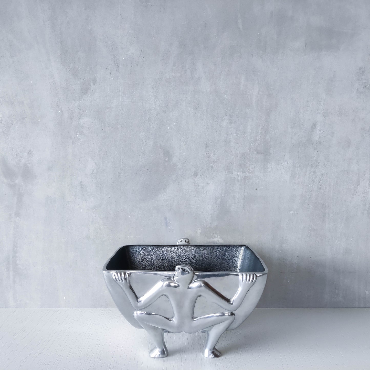 Carrol Boyes 1990s sculptural cast aluminium rectangular fruit bowl with figural feet