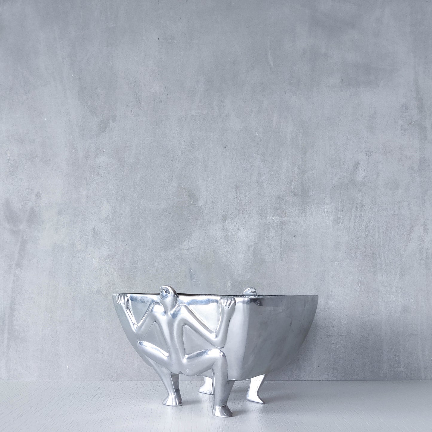 Carrol Boyes 1990s sculptural cast aluminium rectangular fruit bowl with figural feet