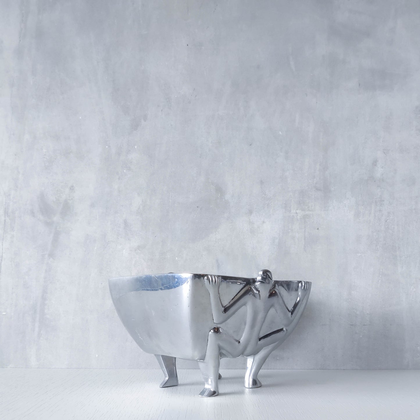 Carrol Boyes 1990s sculptural cast aluminium rectangular fruit bowl with figural feet