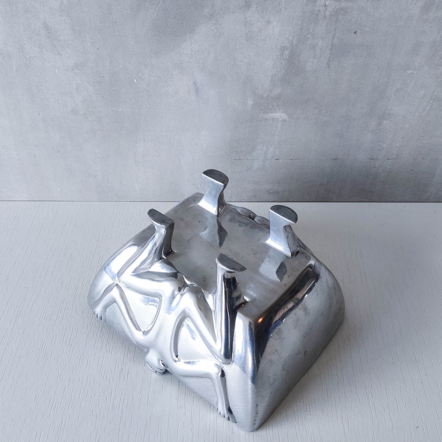 Carrol Boyes 1990s sculptural cast aluminium rectangular fruit bowl with figural feet