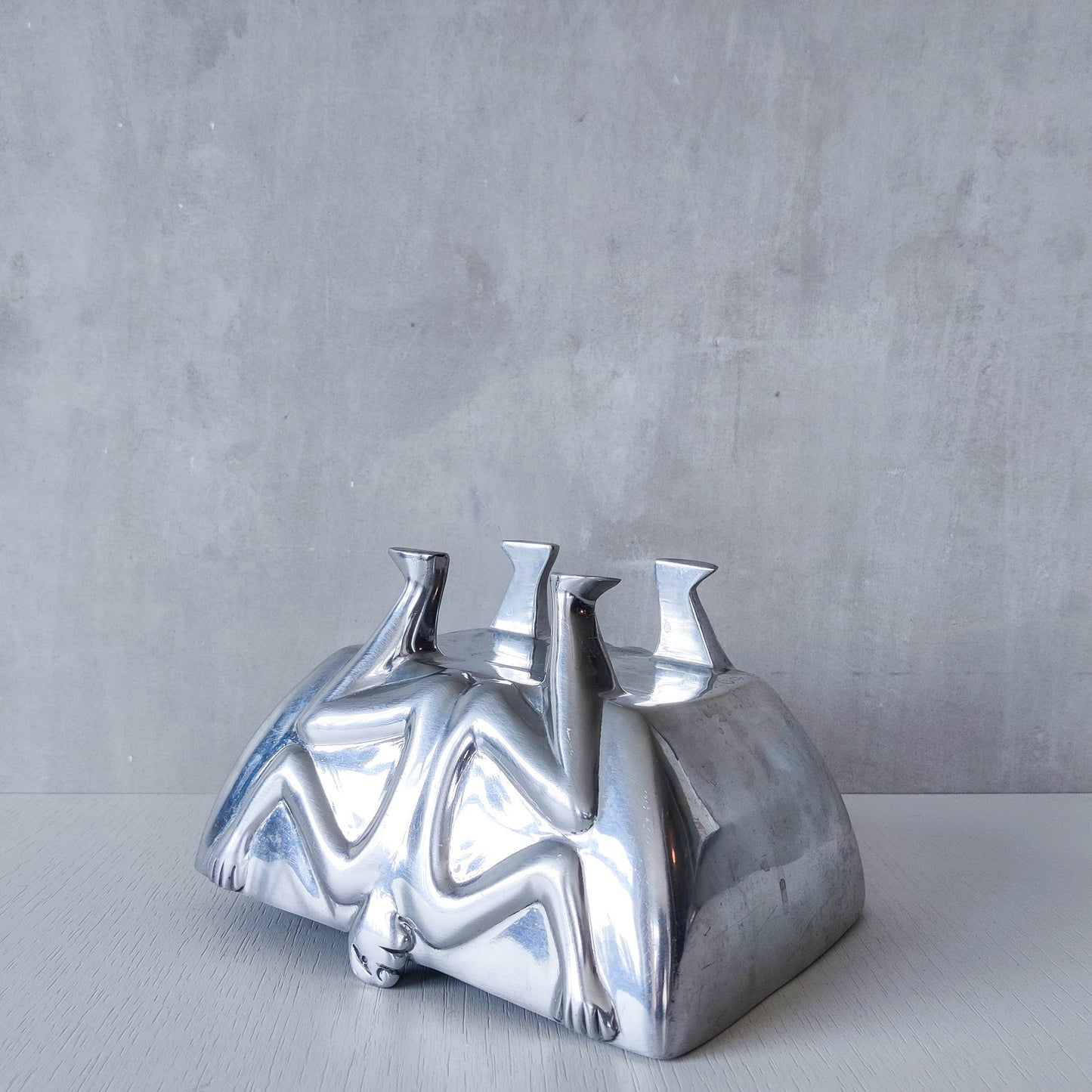 Carrol Boyes 1990s sculptural cast aluminium rectangular fruit bowl with figural feet