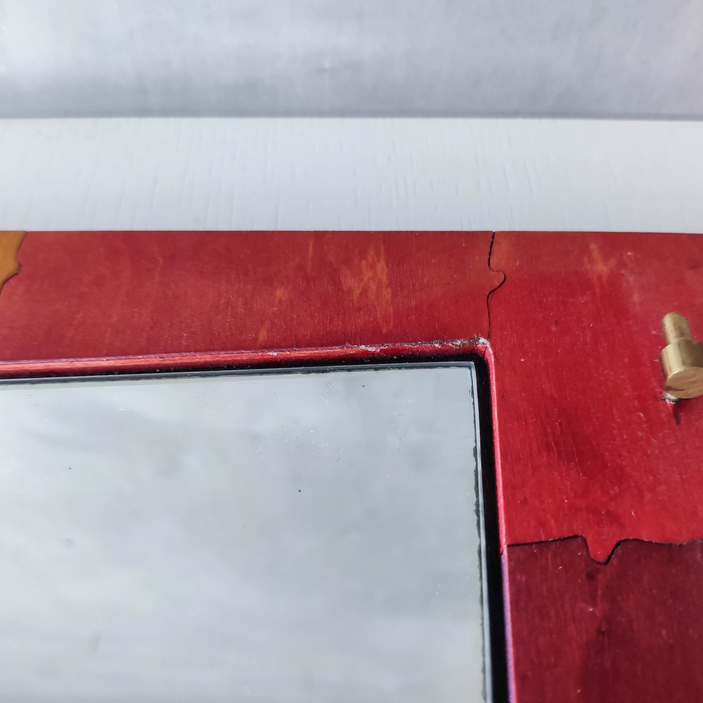 A vintage artist made modernist abstract puzzle mirror with hinged face and hand
