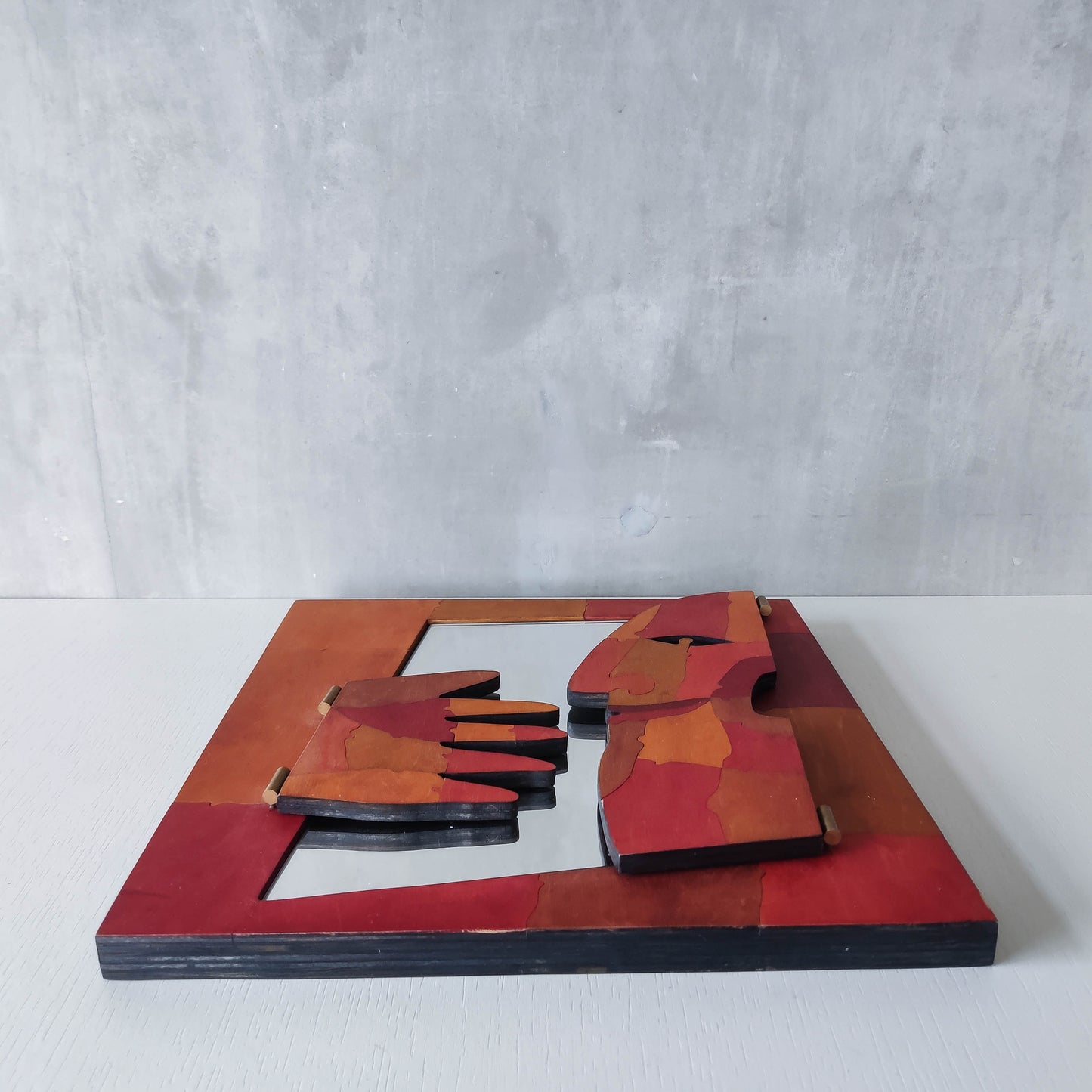 A vintage artist made modernist abstract puzzle mirror with hinged face and hand
