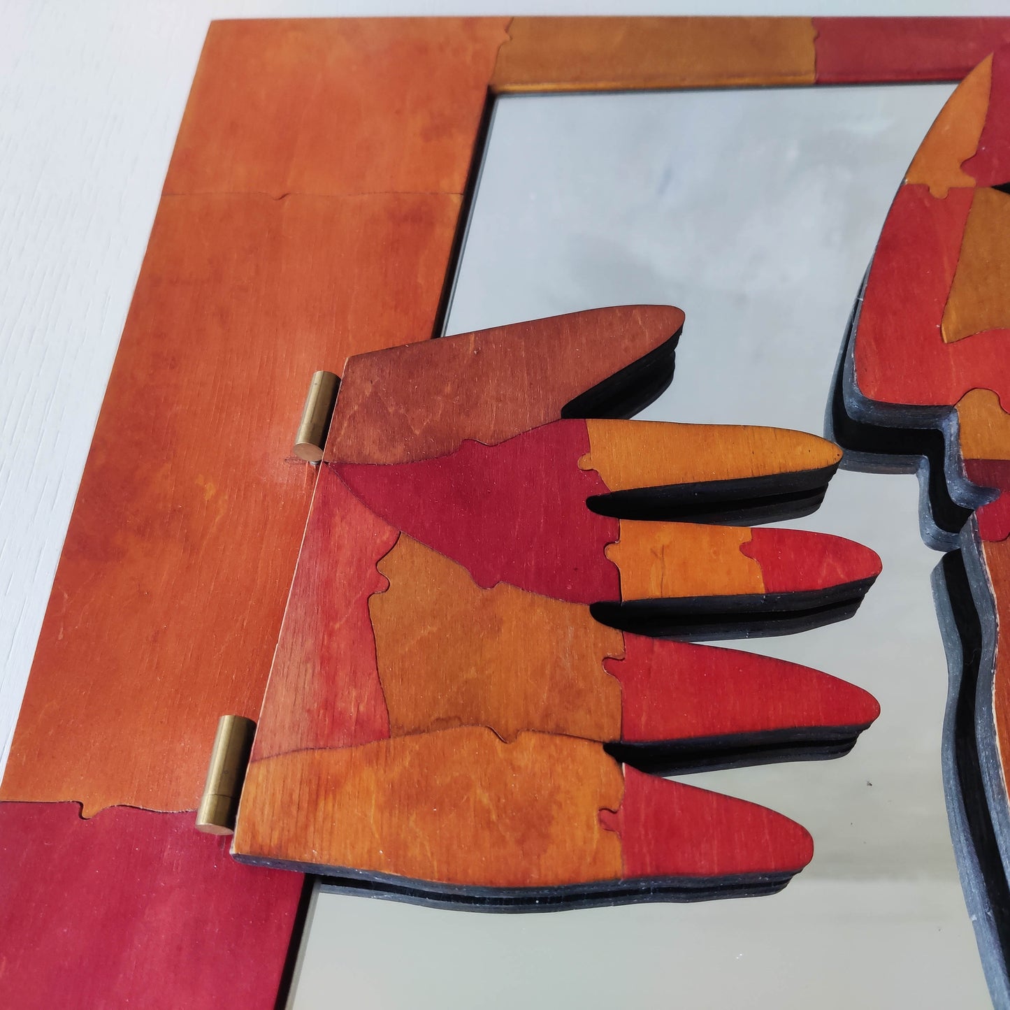 A vintage artist made modernist abstract puzzle mirror with hinged face and hand