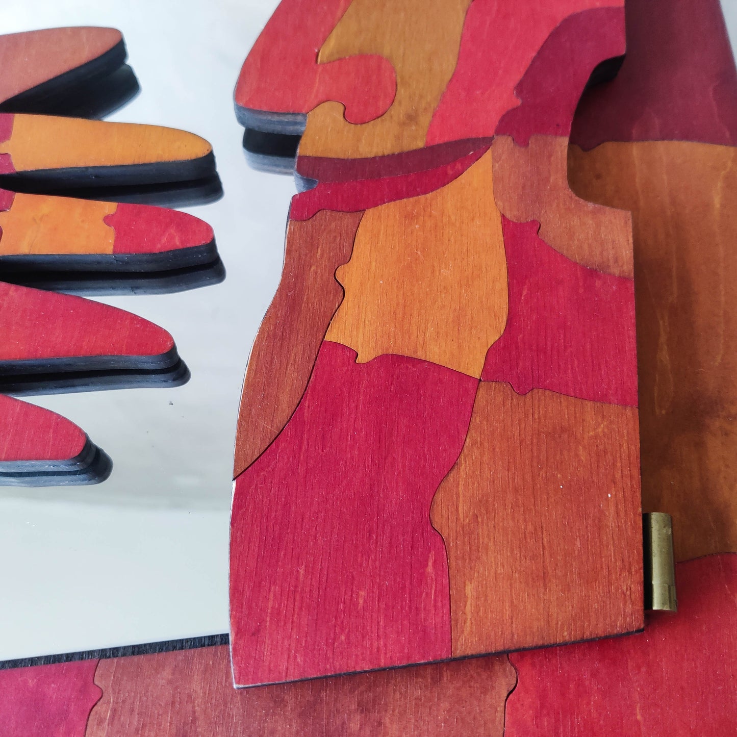 A vintage artist made modernist abstract puzzle mirror with hinged face and hand