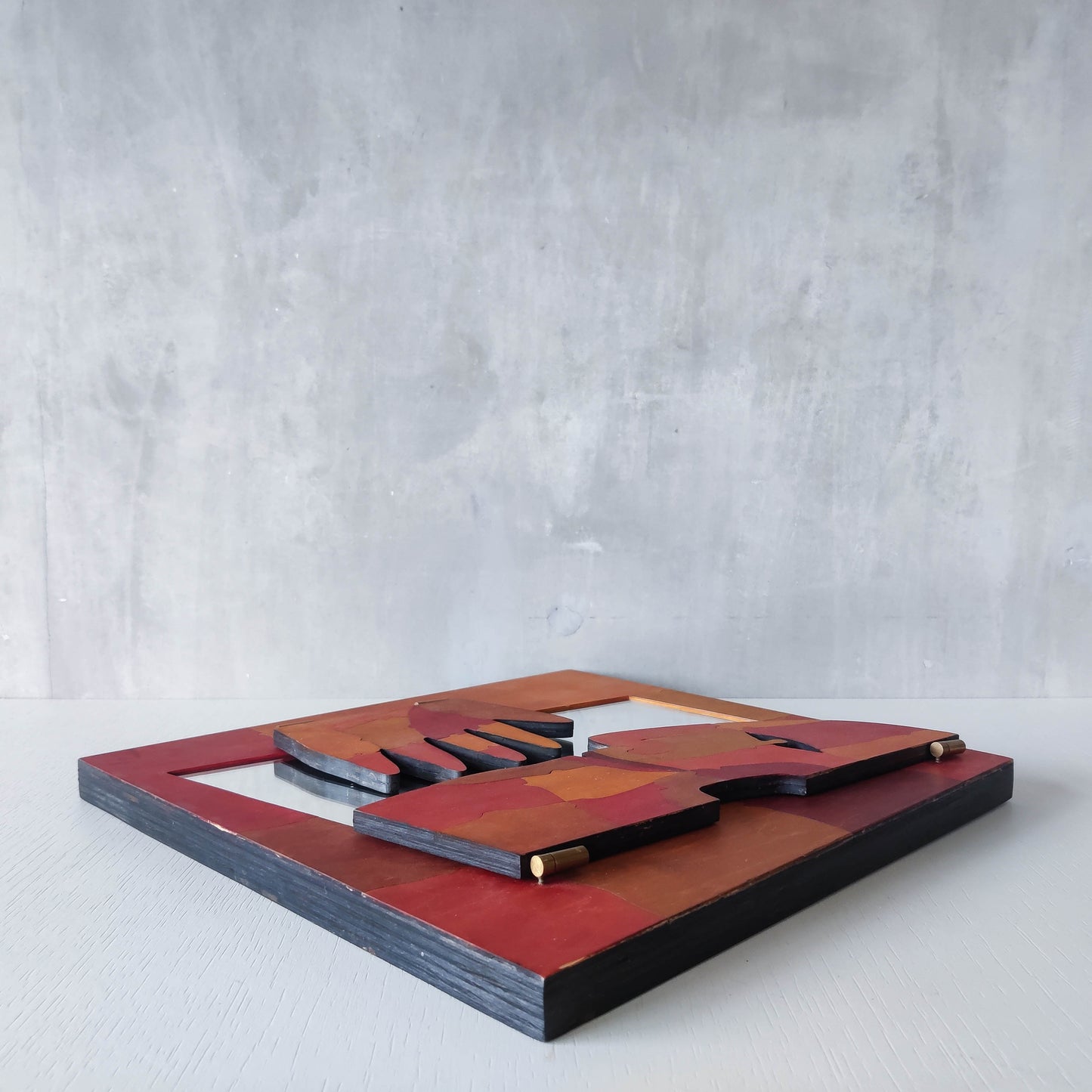 A vintage artist made modernist abstract puzzle mirror with hinged face and hand