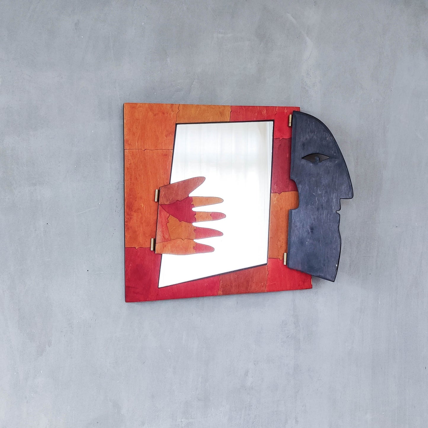 A vintage artist made modernist abstract puzzle mirror with hinged face and hand