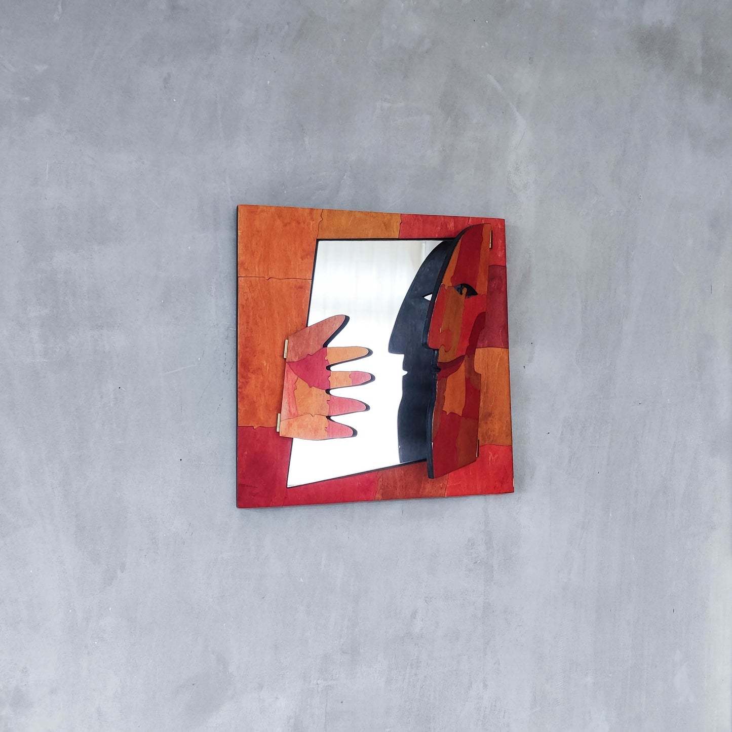 A vintage artist made modernist abstract puzzle mirror with hinged face and hand