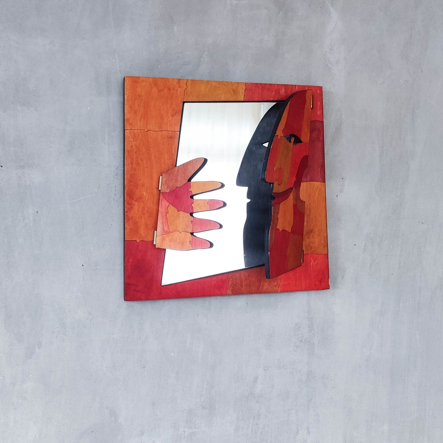 A vintage artist made modernist abstract puzzle mirror with hinged face and hand