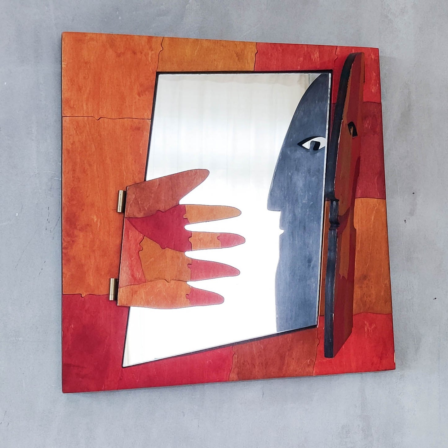 A vintage artist made modernist abstract puzzle mirror with hinged face and hand