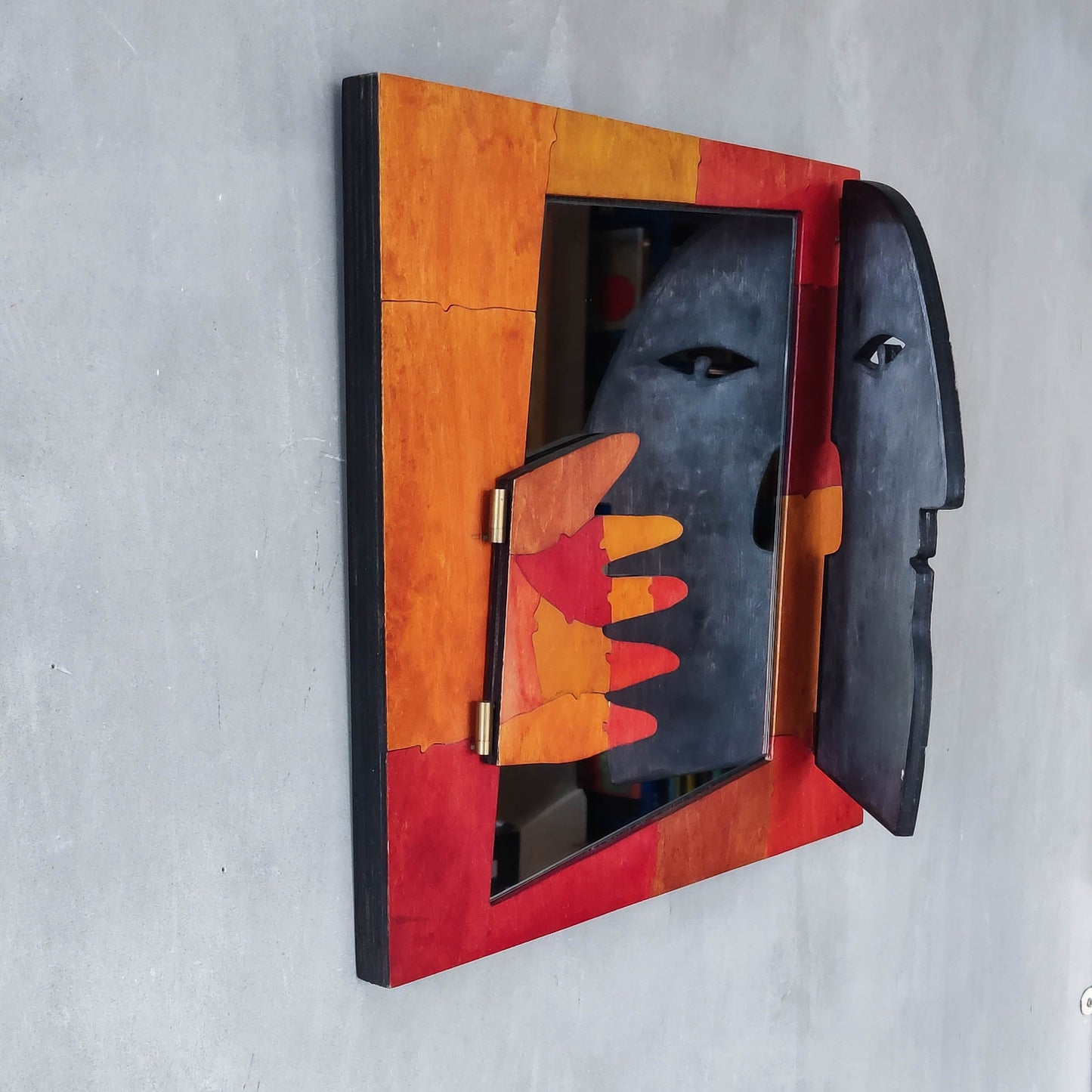 A vintage artist made modernist abstract puzzle mirror with hinged face and hand