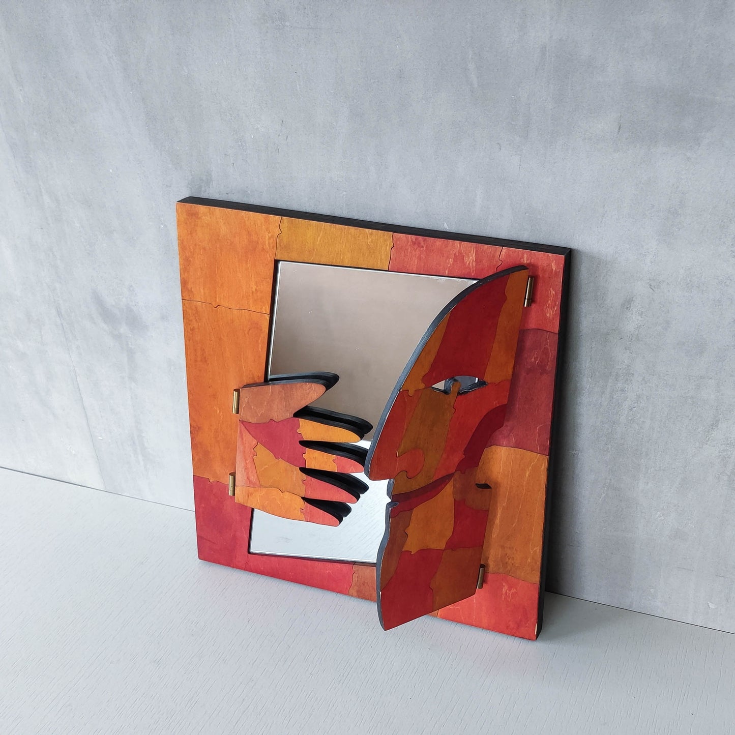 A vintage artist made modernist abstract puzzle mirror with hinged face and hand