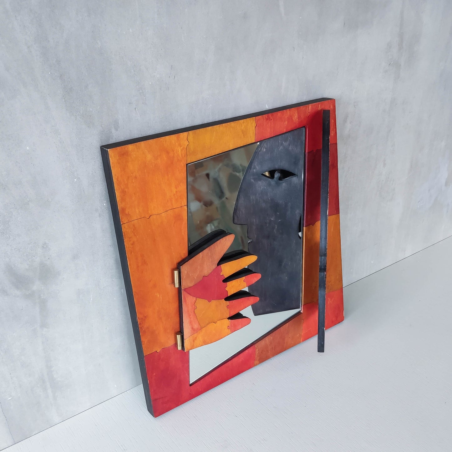 A vintage artist made modernist abstract puzzle mirror with hinged face and hand