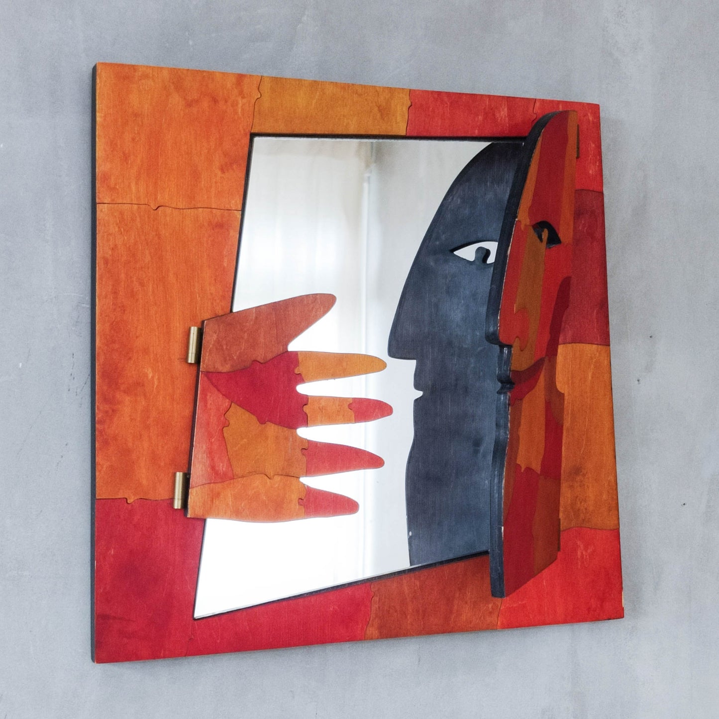 A vintage artist made modernist abstract puzzle mirror with hinged face and hand