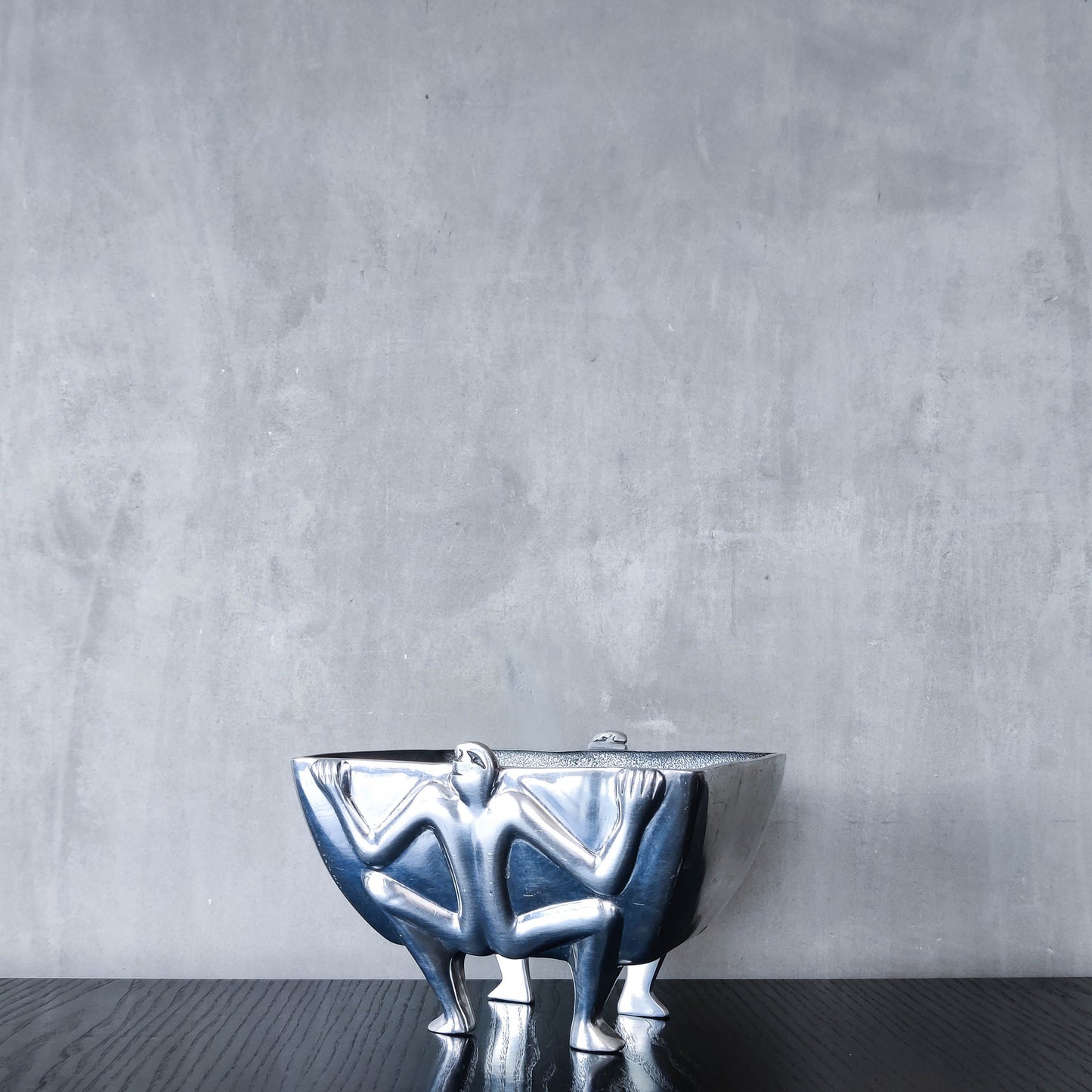 Carrol Boyes 1990s sculptural cast aluminium rectangular fruit bowl with figural feet