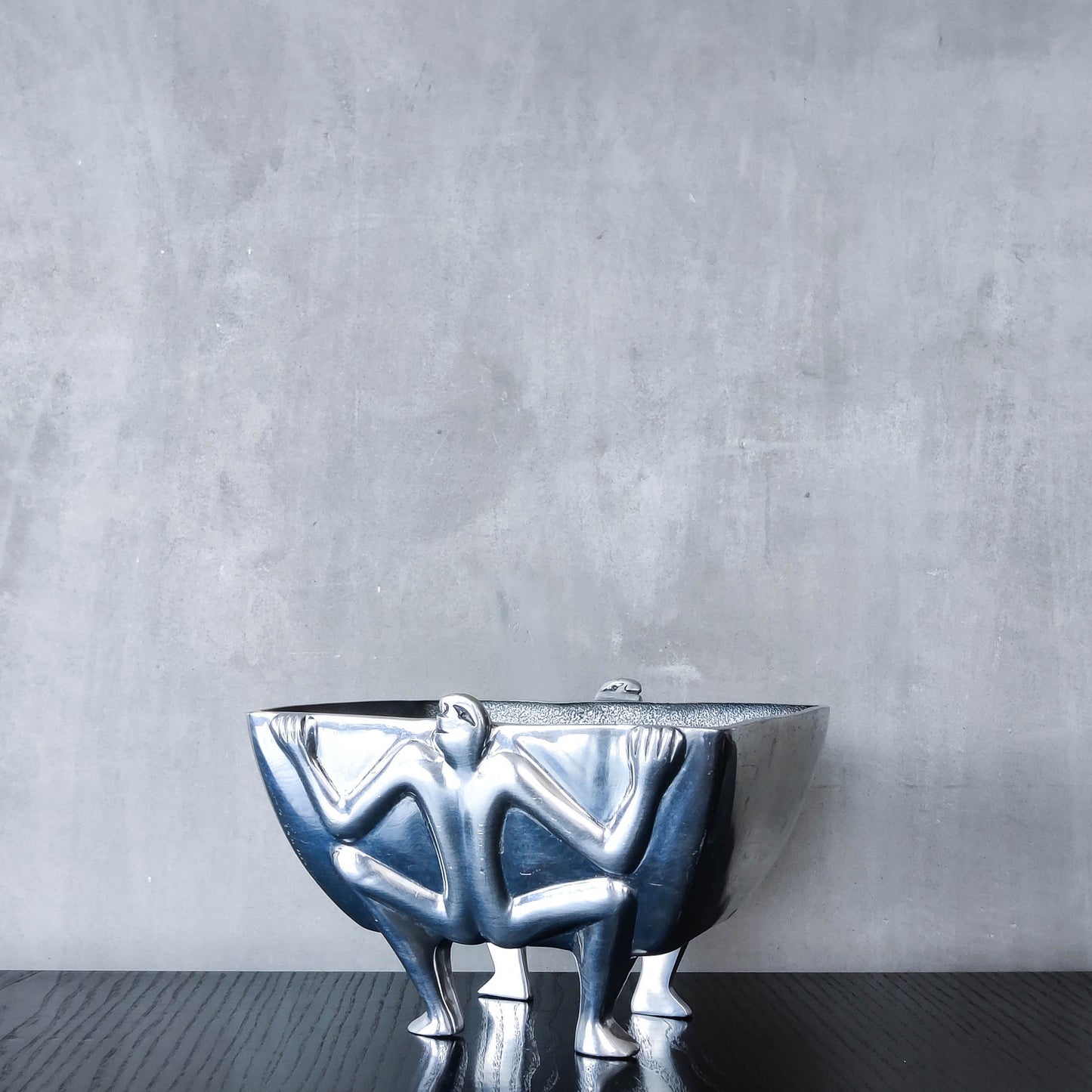 Carrol Boyes 1990s sculptural cast aluminium rectangular fruit bowl with figural feet