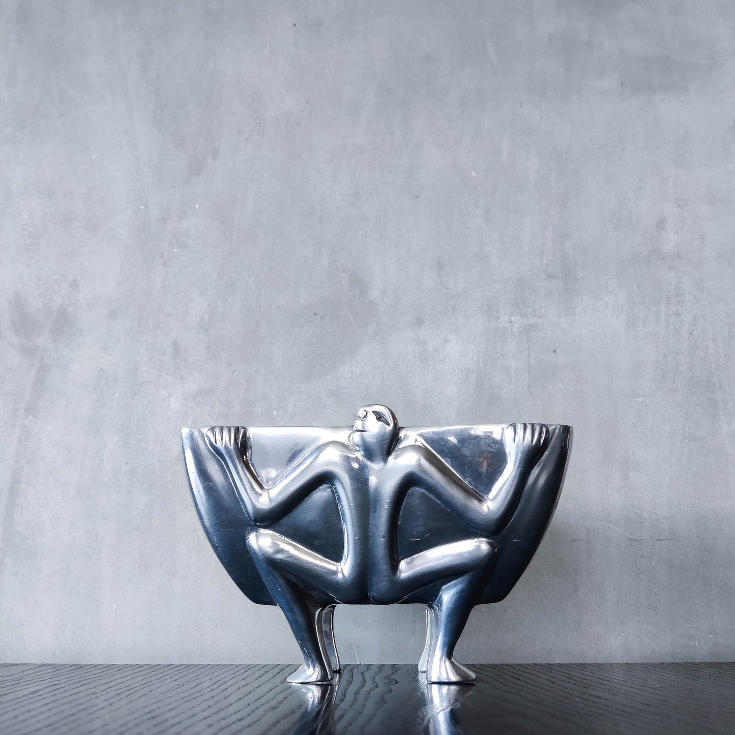 Carrol Boyes 1990s sculptural cast aluminium rectangular fruit bowl with figural feet