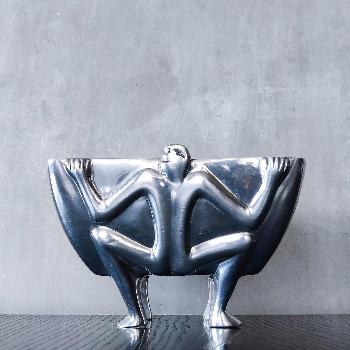 Carrol Boyes 1990s sculptural cast aluminium rectangular fruit bowl with figural feet