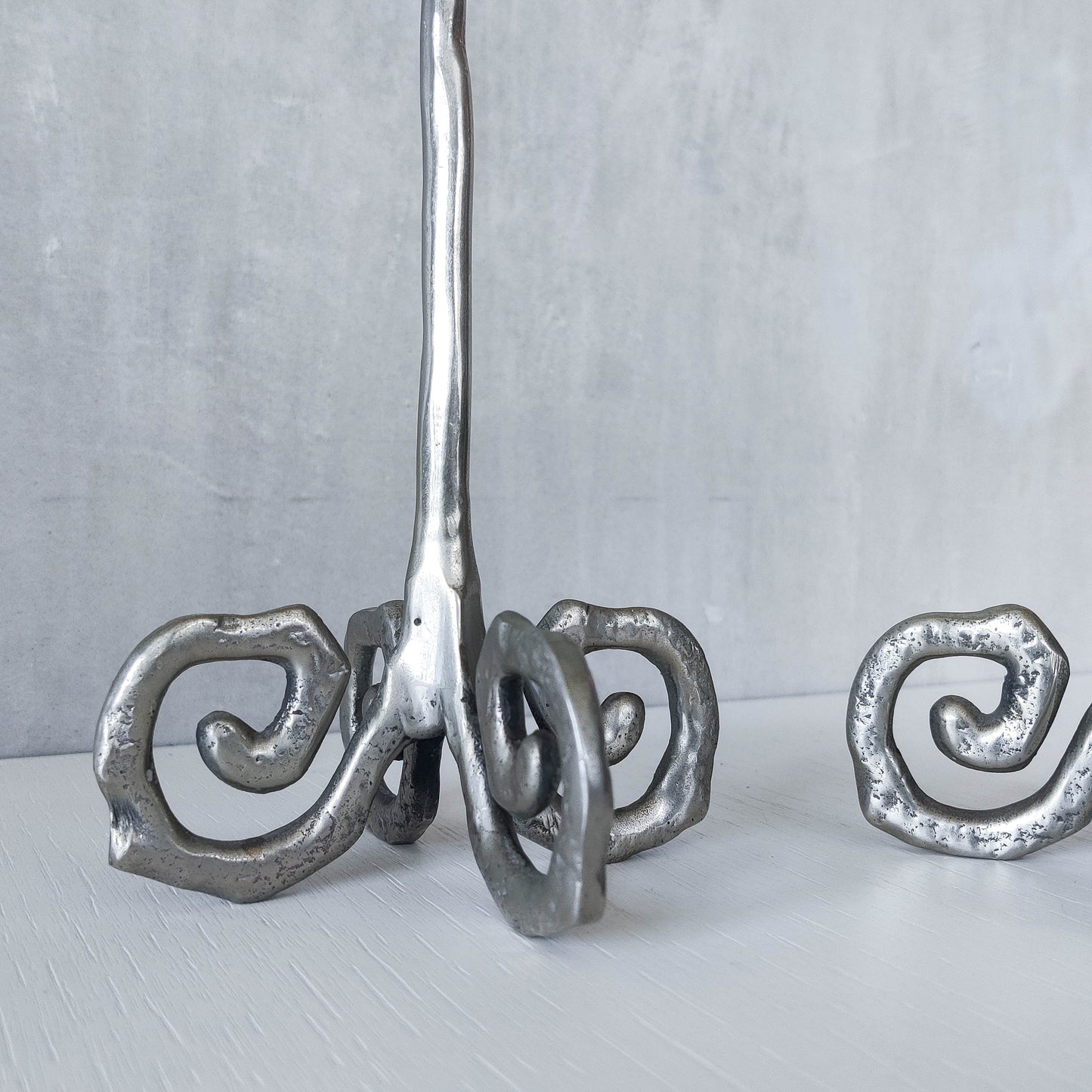 Pair of vintage cast aluminium candle holders with spiral feet