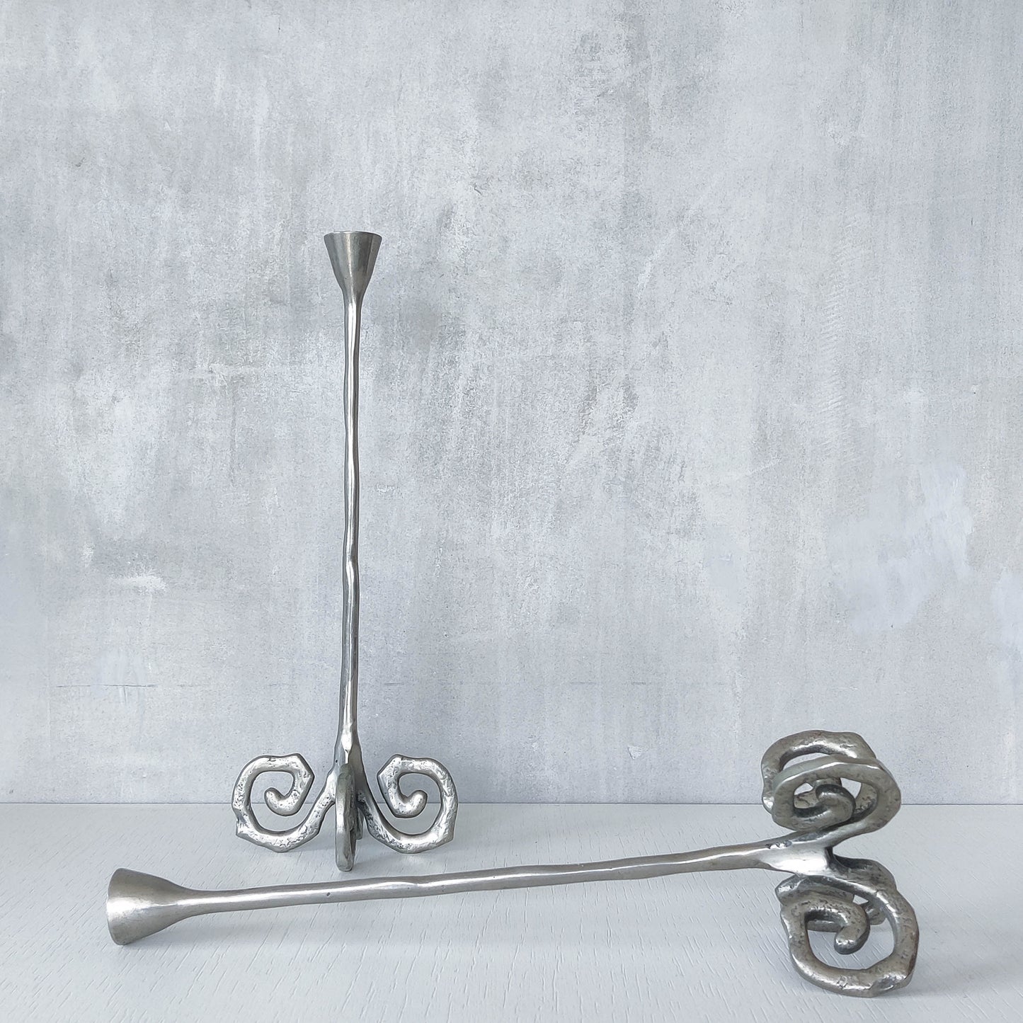 Pair of vintage cast aluminium candle holders with spiral feet