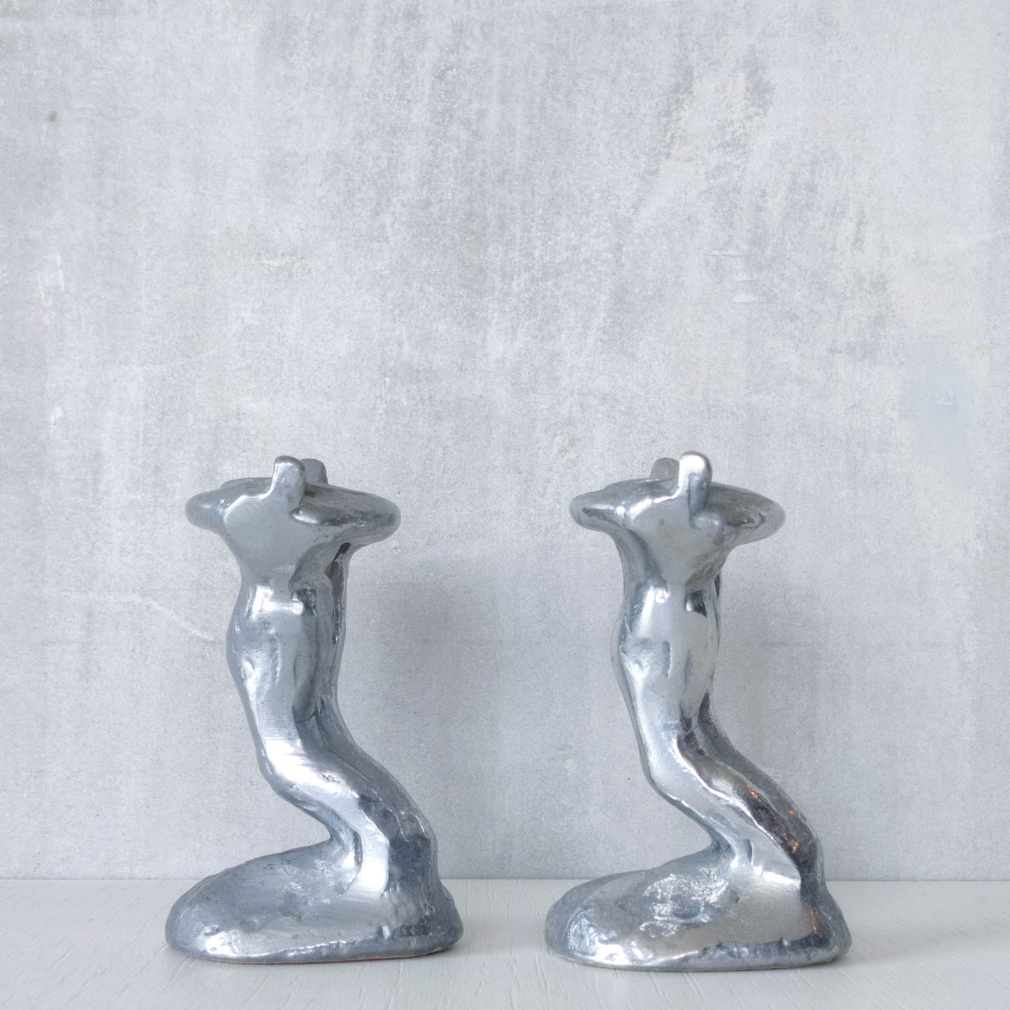 Pair of vintage 1980s ART3 David Marshall style cast aluminum brutalist candle holders