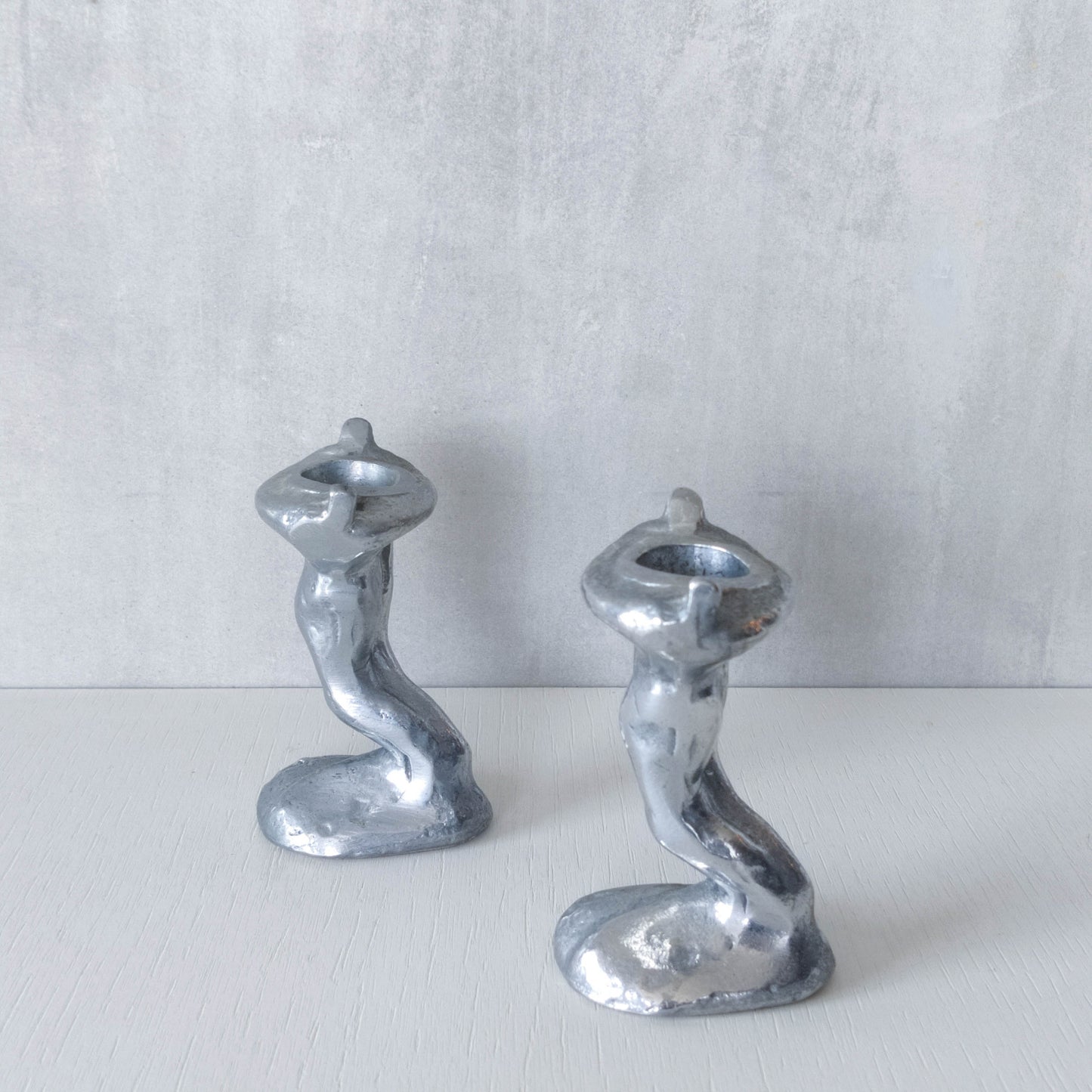 Pair of vintage 1980s ART3 David Marshall style cast aluminum brutalist candle holders