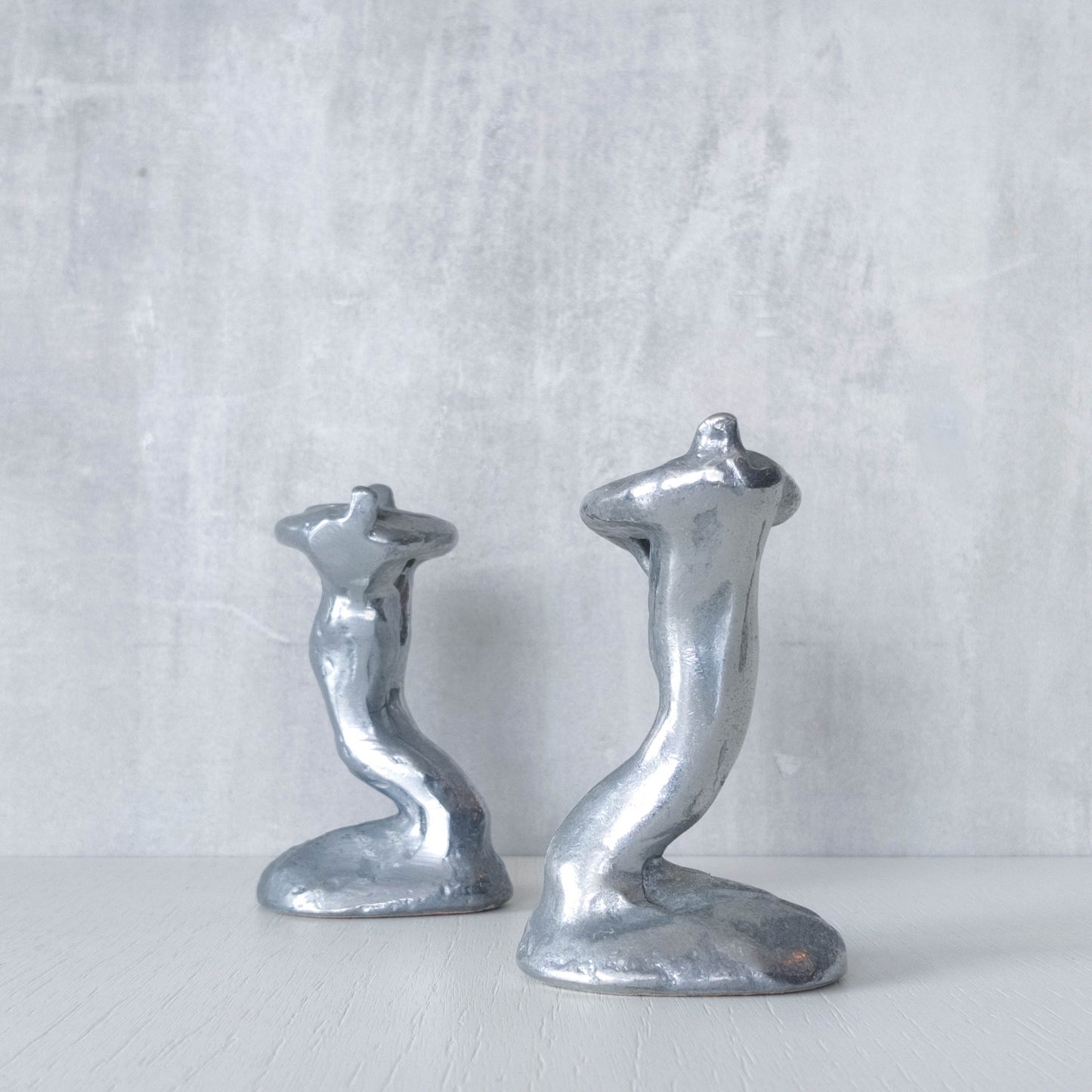 Pair of vintage 1980s ART3 David Marshall style cast aluminum brutalist candle holders