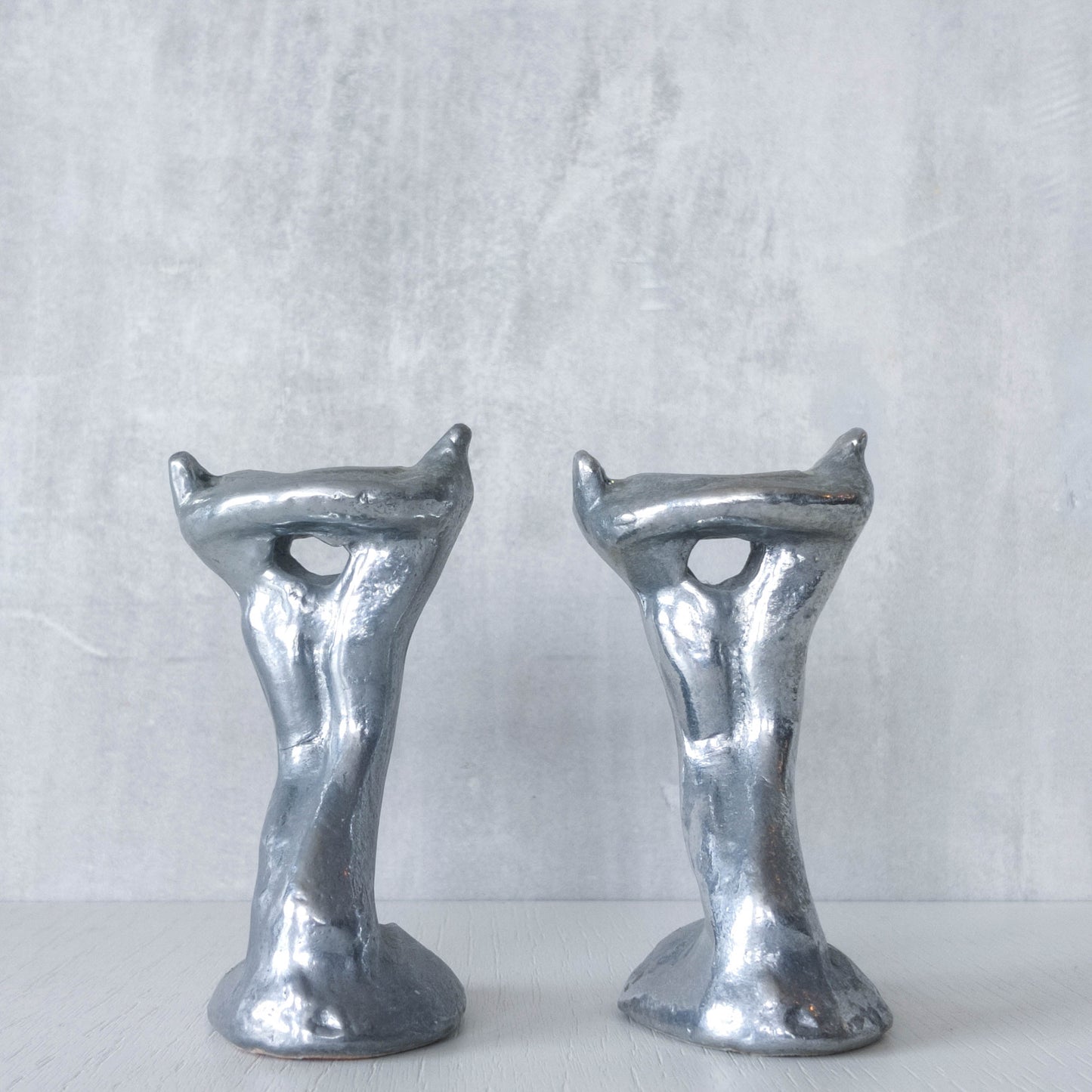 Pair of vintage 1980s ART3 David Marshall style cast aluminum brutalist candle holders