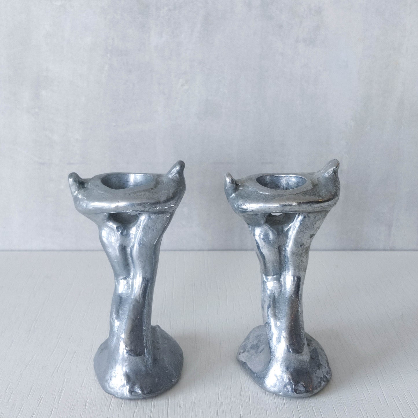 Pair of vintage 1980s ART3 David Marshall style cast aluminum brutalist candle holders