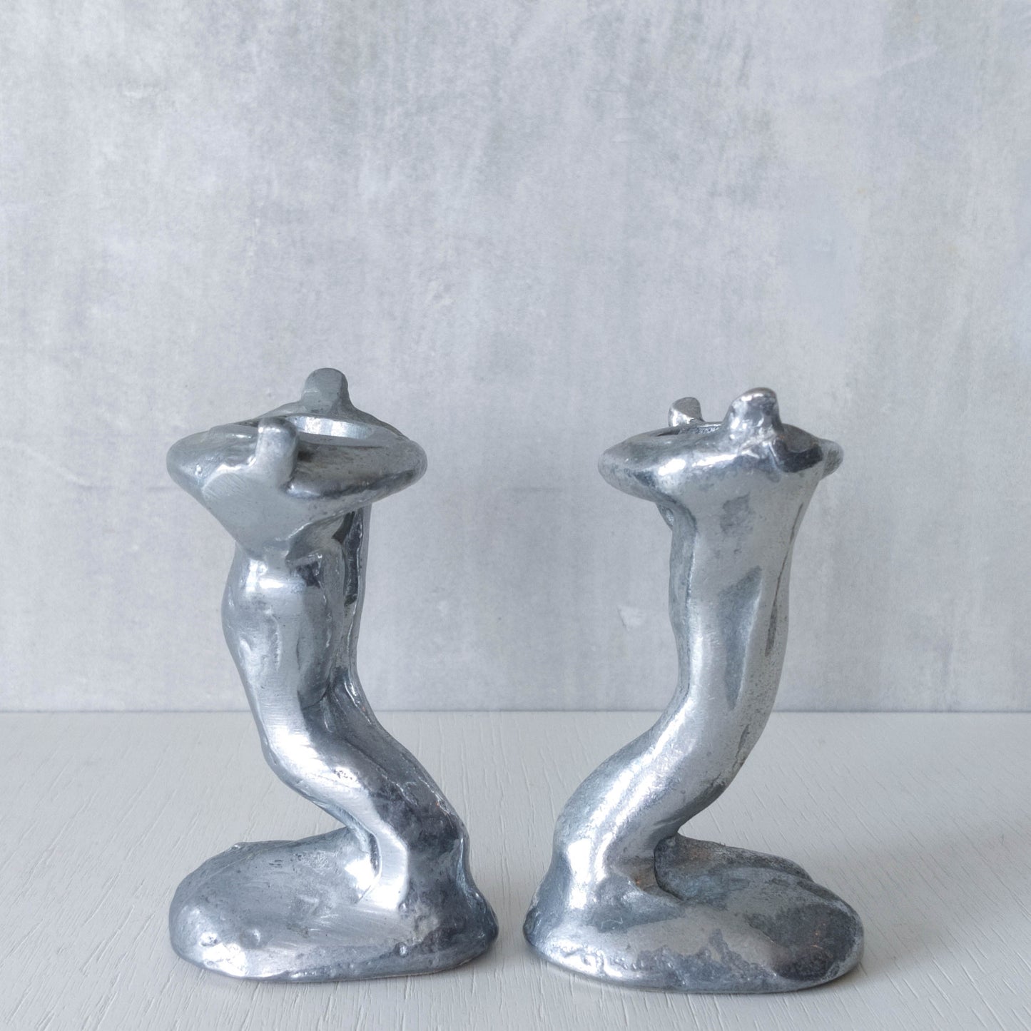 Pair of vintage 1980s ART3 David Marshall style cast aluminum brutalist candle holders